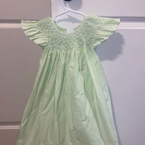 Light green smocked dress with pearl accent